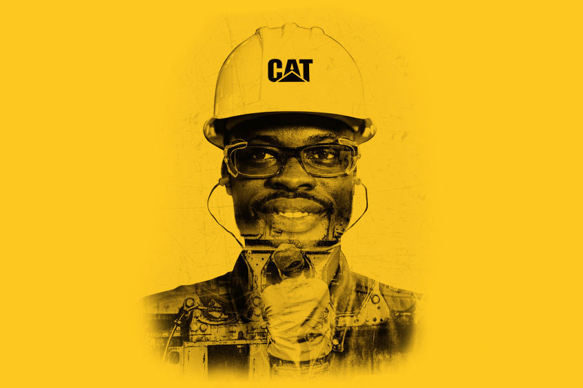 Worker weating CAT hardhat