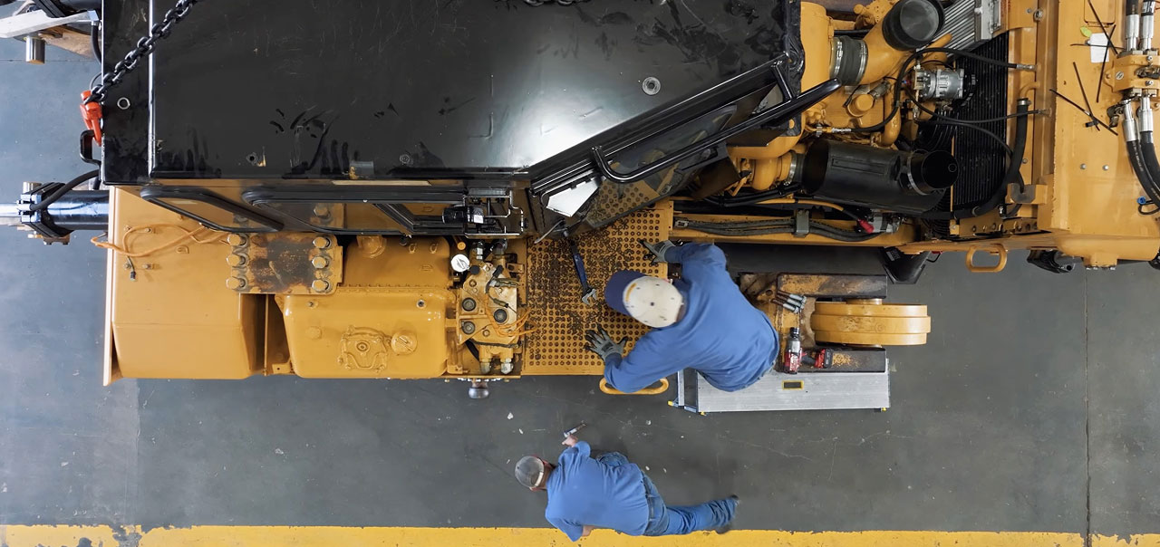 Top down shot of people working with machinery
